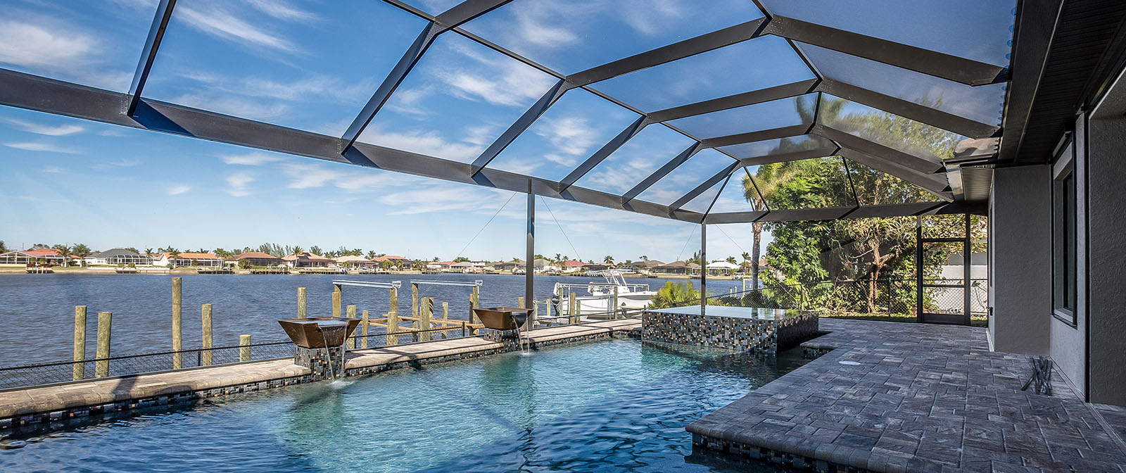 Swimming pool and net enclosure in back of home